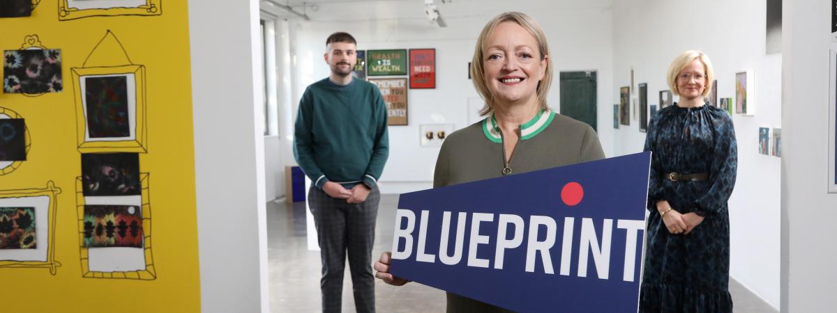 Arts & Business NI team members gather in Golden Thread Gallery to celebrate the launch of Blueprint
