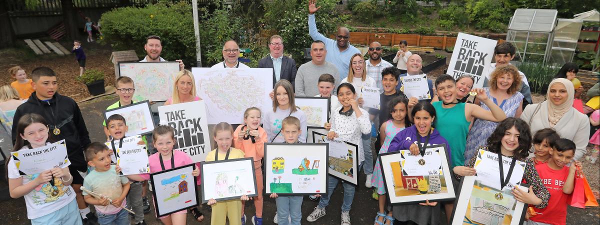 Matthew Lloyd of Matthew Lloyd Architects, winner of the £10,000 prize sponsored by the Oak Foundation, with Take Back the City campaigners who have been working with local communities to develop proposals for the Mackies site for many years. hhttps://www.takebackthecity.ie/competition