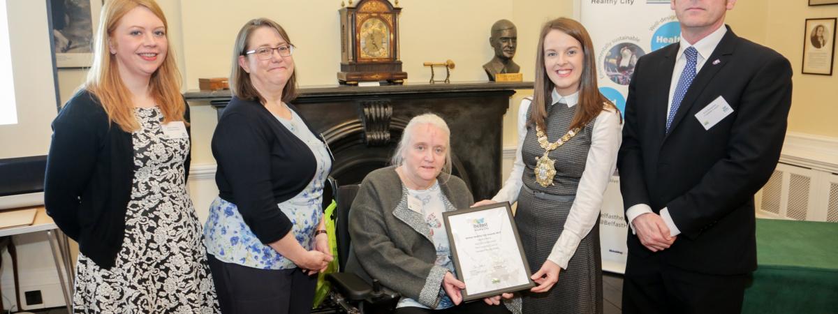 Jenny Robinson, Sinead Dynan and Scott Kennerley (The Consumer Council) and Vivien Blakely (IMTAC) are presented with 2017 WHO Belfast Health City Awards commendation by Lord Mayor Nuala McAllister. 