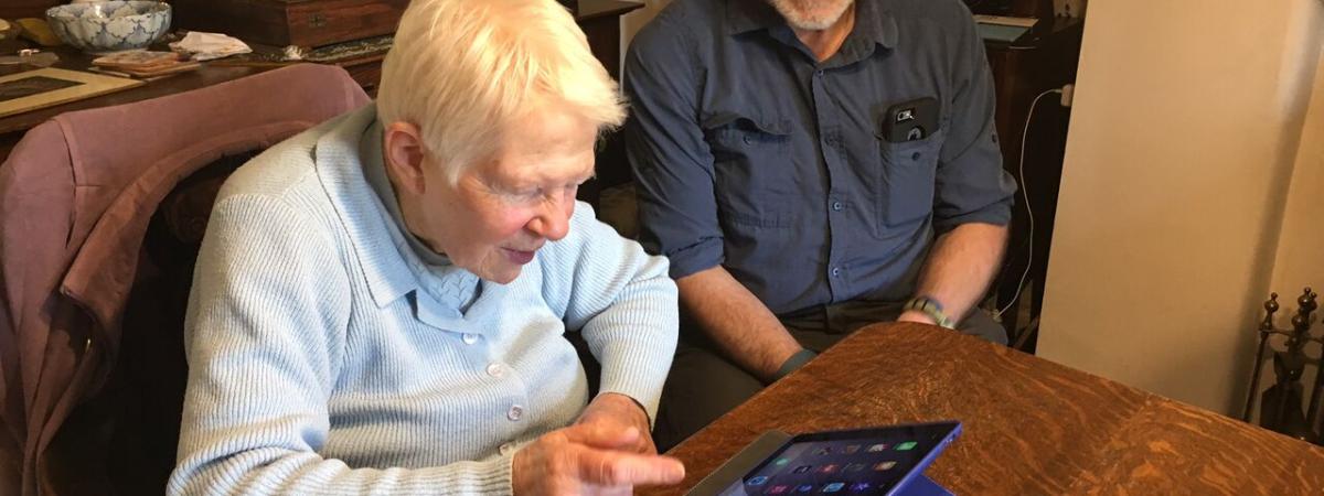 A volunteer visiting a disabled person at home