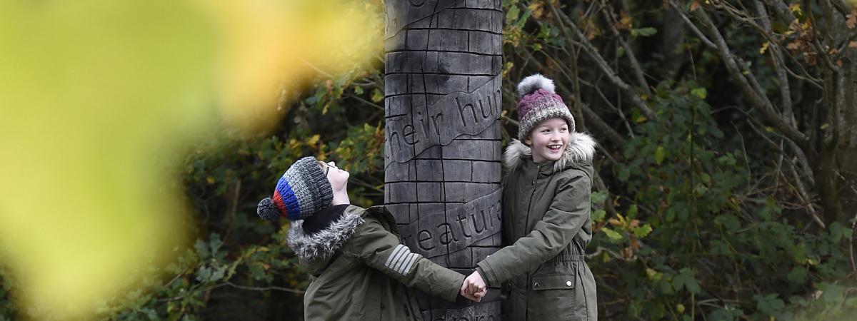 Jack and Sophie Tinman inspect the new charter pole at Friends of Belvoir Wood