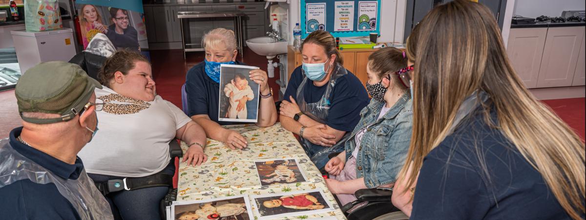 Young people participating in an activity session, picutred with volunteers and staff including Sandra McDonald and Lynne Morrison at Shaftsbury Community and Recreation Centre, Belfast