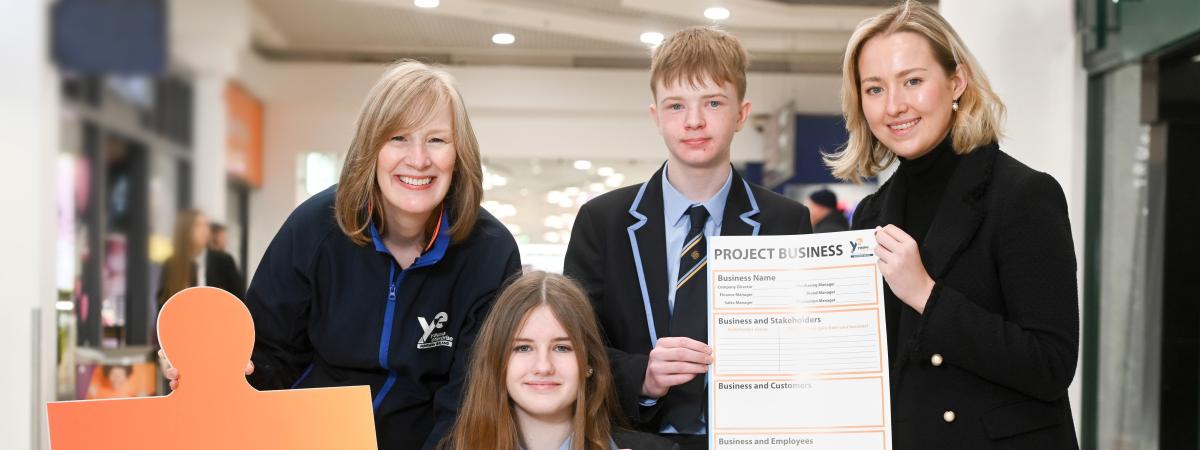 (L-R) Jan Donaldson, Head of Stakeholder Engagement, Young Enterprise NI; pupils from Parkhill Integrated College, Antrim; and Robyn McCaughey, Resourcing Specialist, Allen & Overy launch the Project Business Programme.  