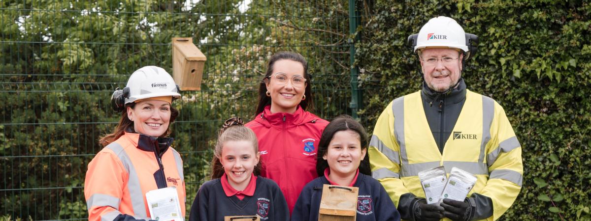 Pictured (L-R) is firmus energy’s Environment, Health, and Safety manager Chantal Hemphill, Broadbridge Primary School pupil Katherine Benison, Eco Teacher Miss O’Neill, pupil Willow Deeney, and Micheol O’Gallcobhair from Kier.