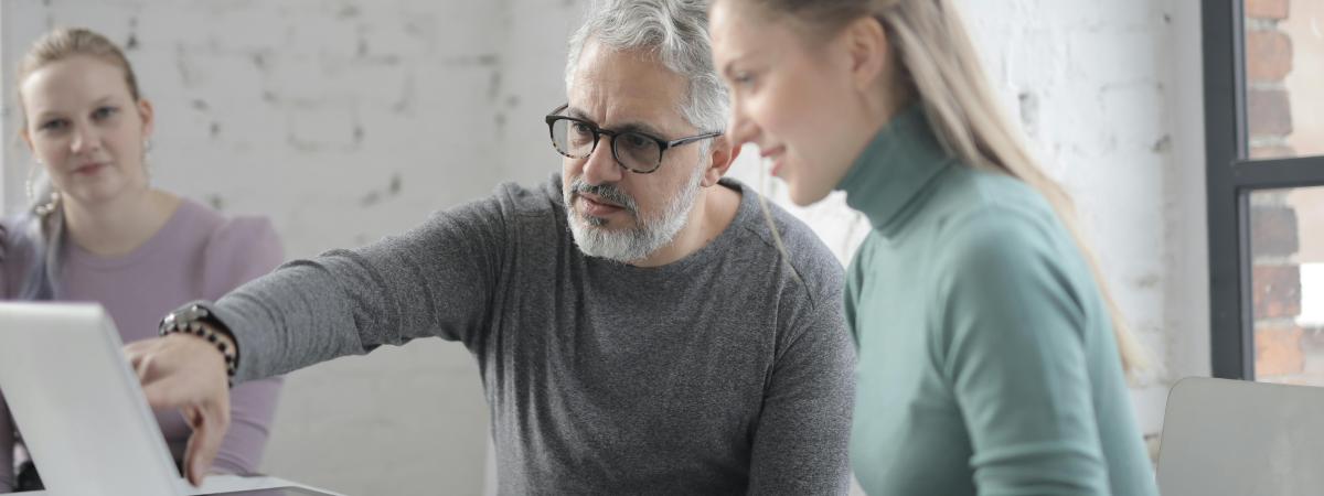 Man pointing at computer screen