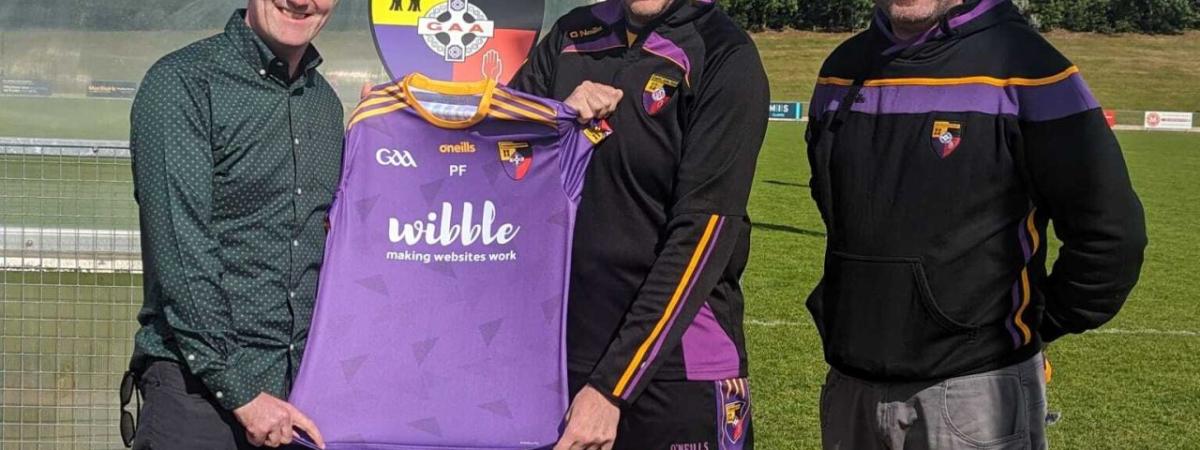 Wibble Web Design Belfast proudly announces sponsorship of Carryduff GAC - presnetation photo