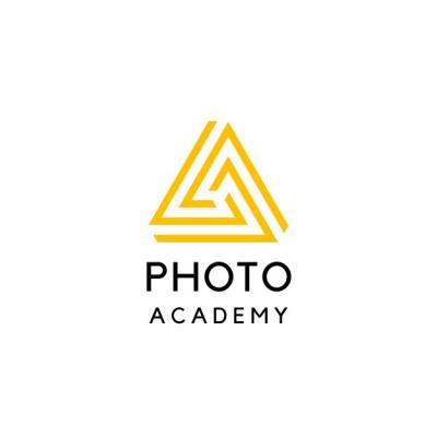 The Photo Academy NI logo - yellow and black triangle with the words photo academy written underneath