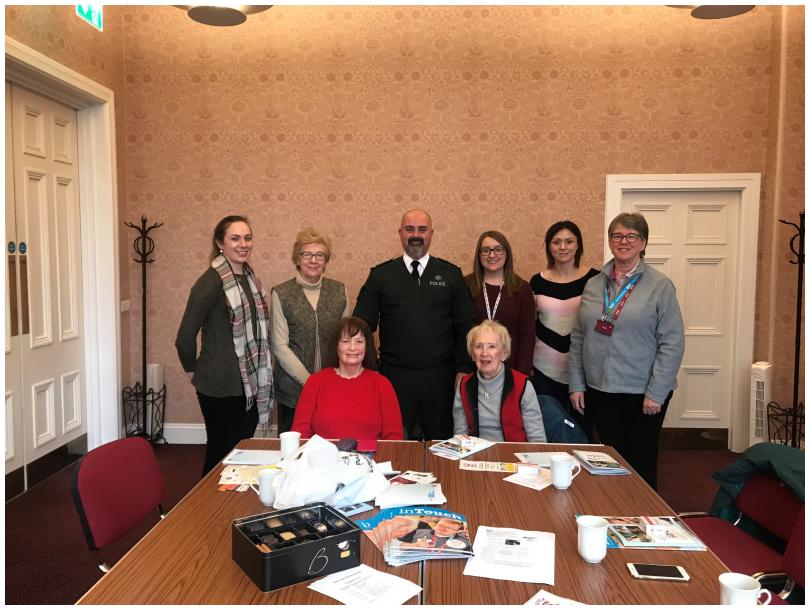 Some group members having a home safety talk from the PSNI