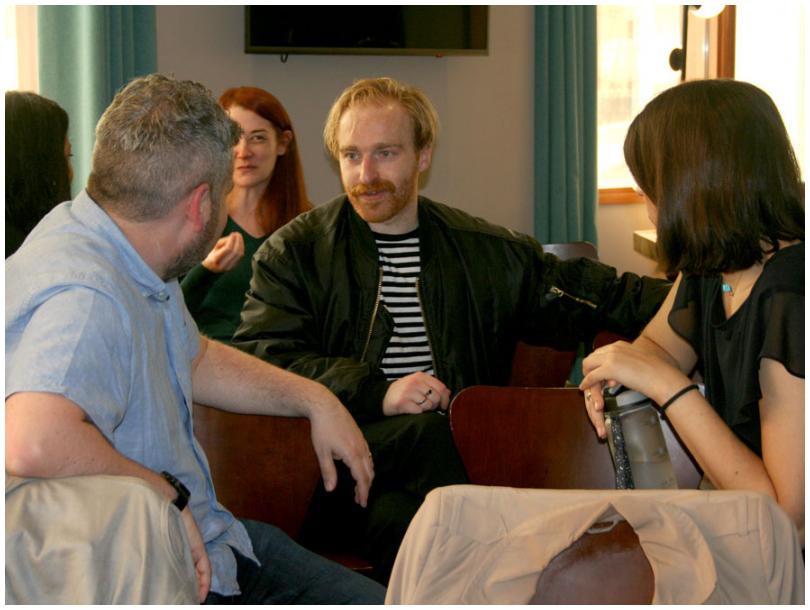 People chatting at an informal event