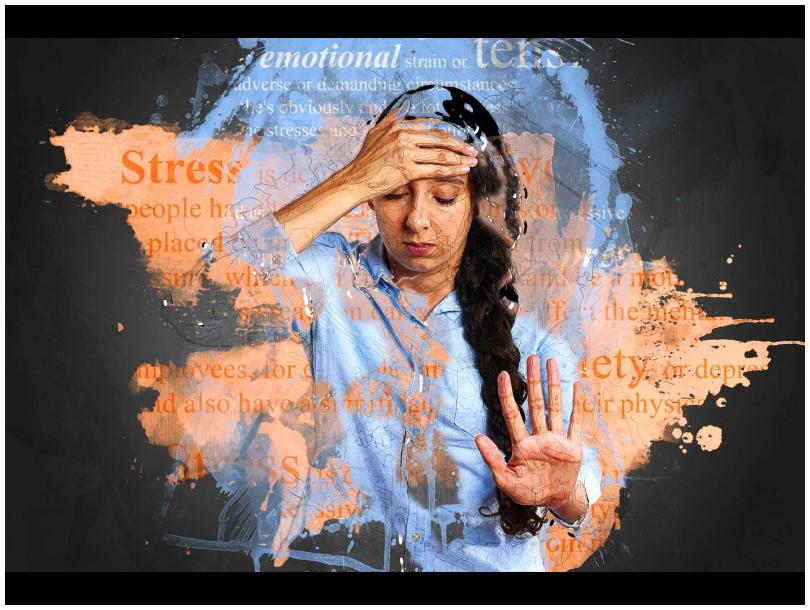 Image of a woman with her hand on her forehead and other hand in front of her, a blended image with the definition of what stress is merges with the image