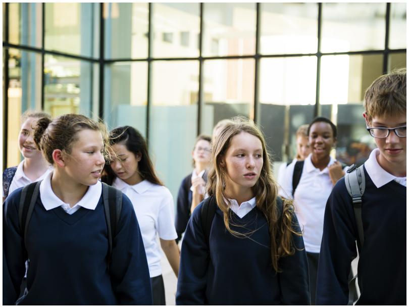 Group of school pupils walking. 