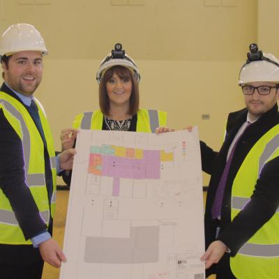 Image 1 – Noel Rooney, Ortus Property Development Executive, Catherine McClelland, Roar and Explore Project Manager and Conor Smith, Housing Executive System Manager Social Investment Team with the plans for Roar and Explore