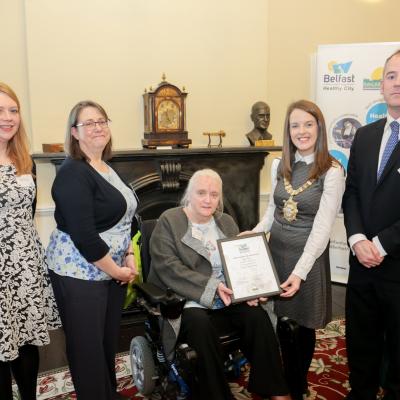 Jenny Robinson, Sinead Dynan and Scott Kennerley (The Consumer Council) and Vivien Blakely (IMTAC) are presented with 2017 WHO Belfast Health City Awards commendation by Lord Mayor Nuala McAllister. 