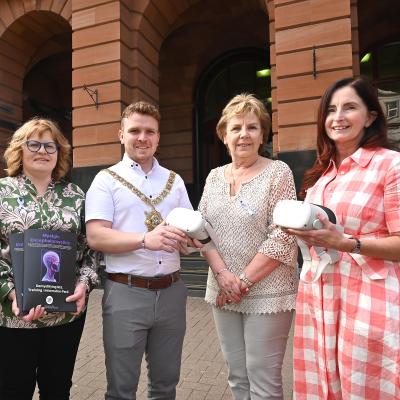 From left Professor Deepa Mann-Kler (CEO, Neon & Ulster University professor), Linda Campbell (chair, Hope 4 ME & Fibro), Lord Mayor Councillor Ryan Murphy, Joan McParland MBE (Hope 4 ME & Fibro founder) and Julie Reid (deputy head of services, Libraries NI)