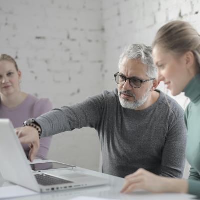 Man pointing at computer screen